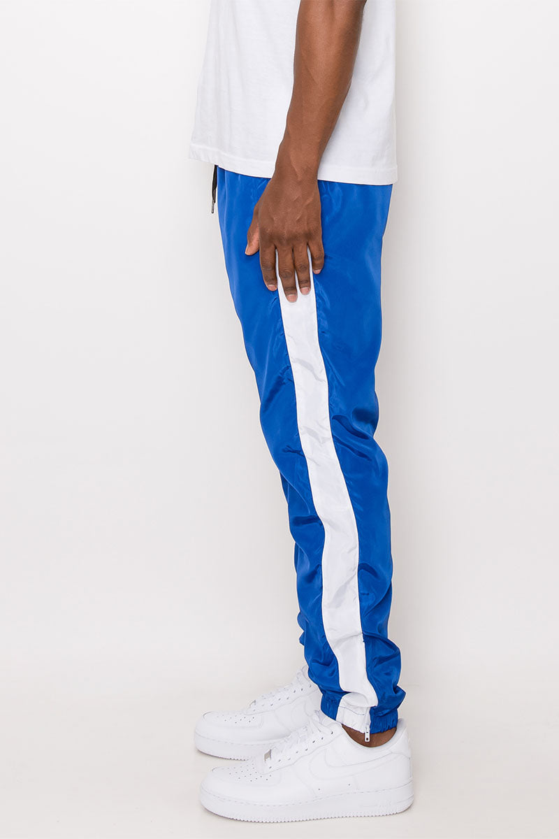 Blue joggers with white stripe deals